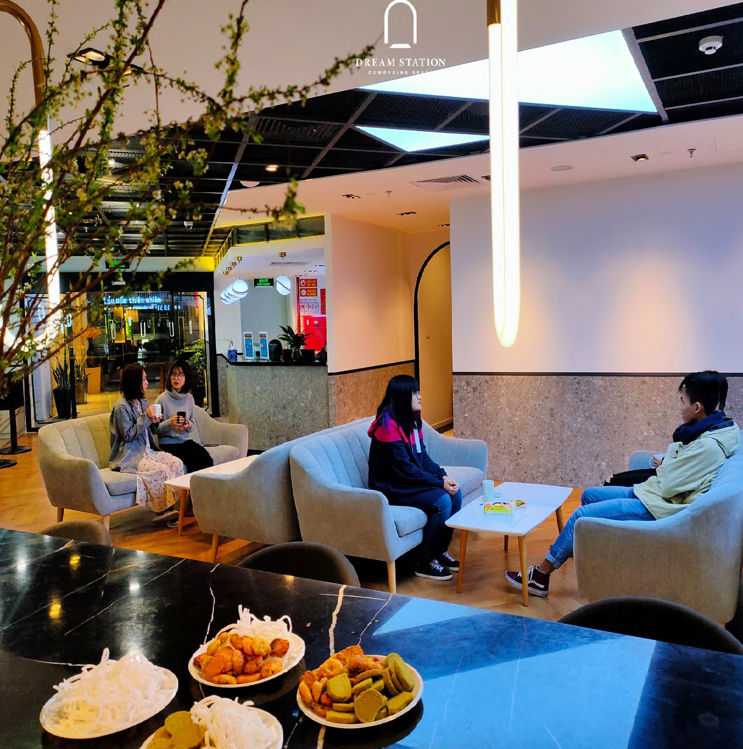 A photo of Hivelab's lounge with tables and amenities